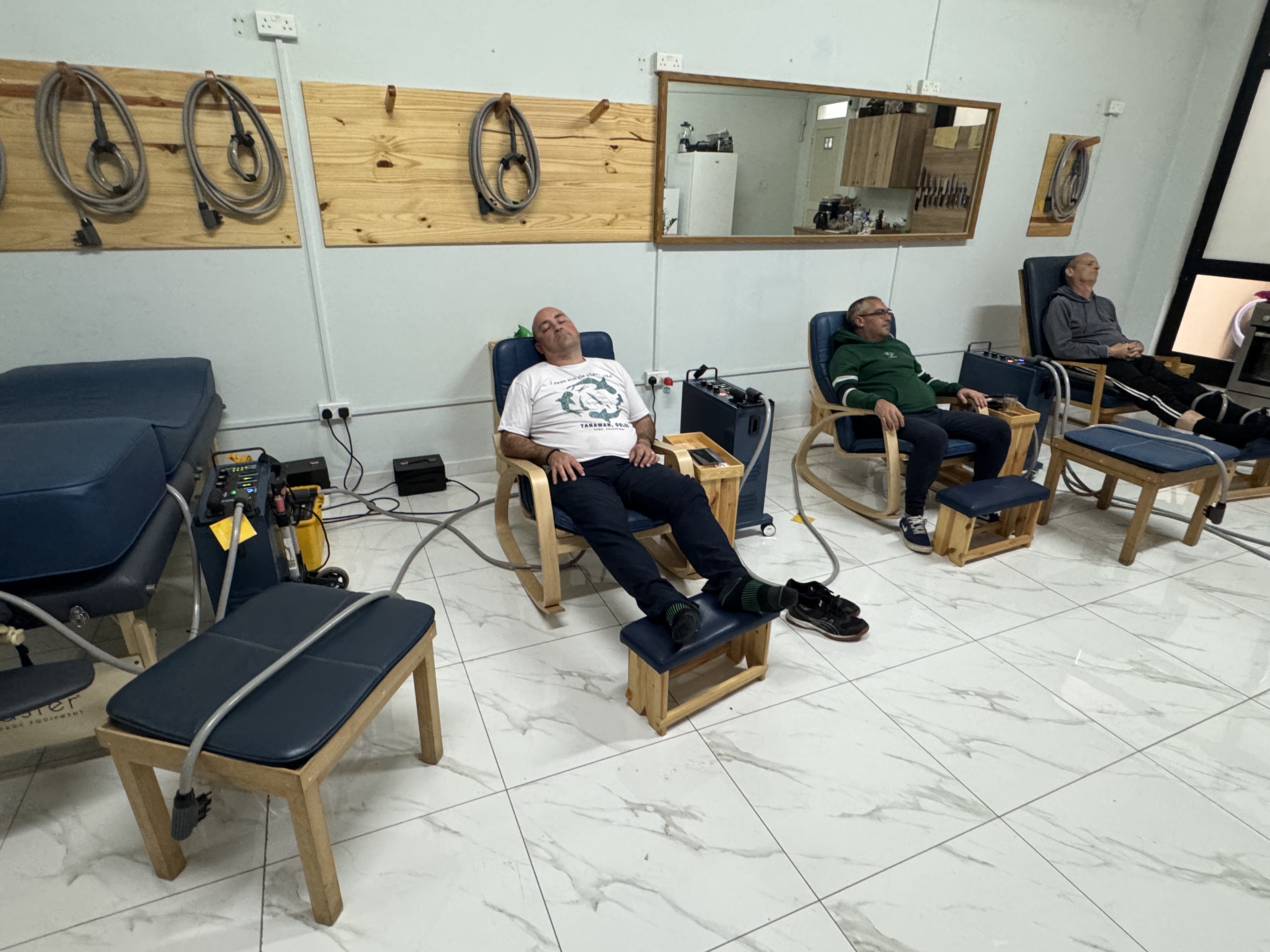 Client receiving PEMF therapy session